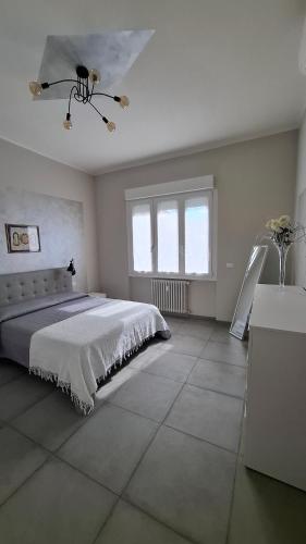 a bedroom with a large bed and a window at Casa Silvan in Sesto Fiorentino