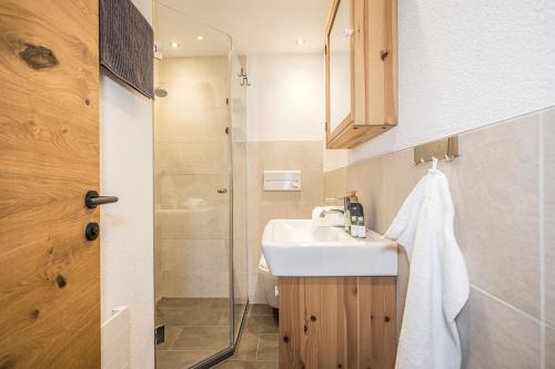 a bathroom with a sink and a shower at Haus Barbara in Alpbach
