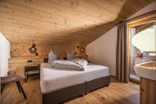 a bedroom with a bed and a sink at Haus Barbara in Alpbach