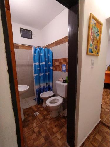 a bathroom with a toilet and a sink at Lo del Tata in Villa Unión