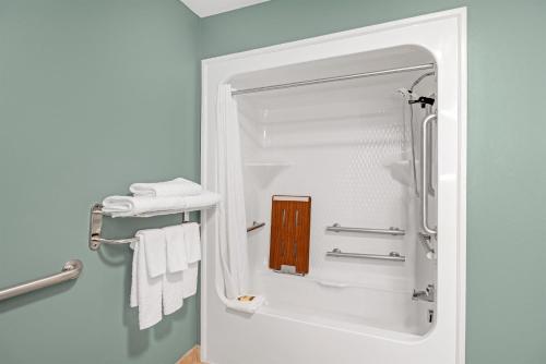 a bathroom with a shower with a mirror at Best Western Plus Glen Allen Inn in Richmond