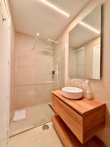 a bathroom with a sink and a shower at Miriam by Dozzze in Madrid