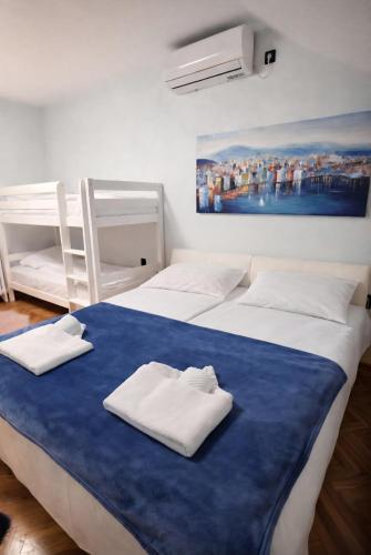a bedroom with two beds with towels on it at AR Vila Kikinda in Kikinda