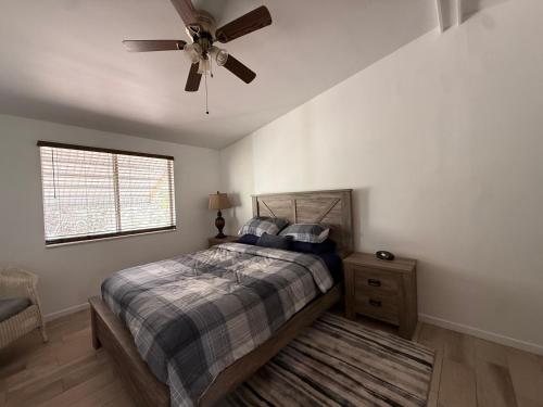 a bedroom with a bed and a ceiling fan at Safehaven in Avon Park