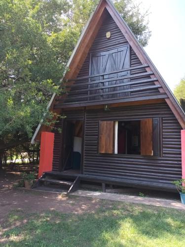 a small house with a gambrel roof at Complejo El Tala in Villa la Bolsa