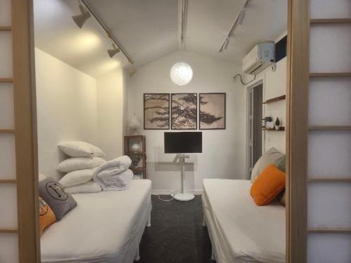 Postel nebo postele na pokoji v ubytování Nouhastay