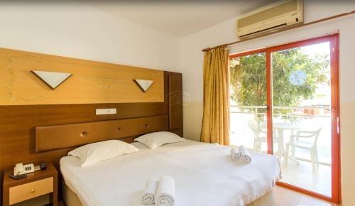 Postel nebo postele na pokoji v ubytování Wassermann Hotel