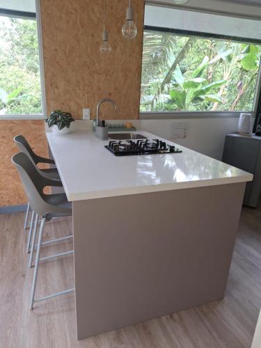 a kitchen with a white counter top and a sink at Cabaña Corolaine in San Francisco