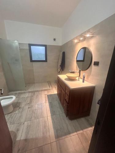 a bathroom with a sink and a mirror at Casa Quinta in Córdoba