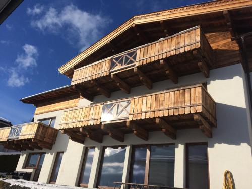 a building with wooden balconies on it at Stadtalm Islitzer in Mittersill