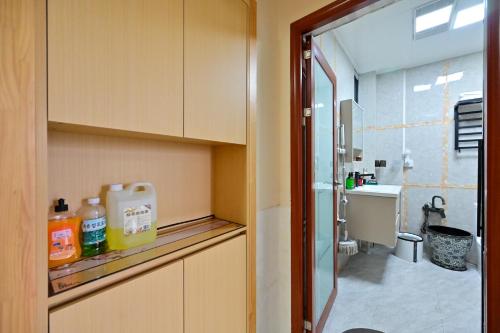 a bathroom with a sink and a toilet in a room at Xia Jiming-s store in Ganzhou