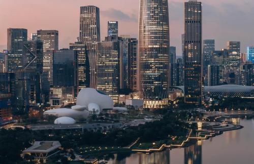 a view of a large city at night at Andaz Shenzhen Bay in Shenzhen