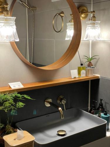 a bathroom with a sink and a mirror at 응정헌 in Seoul