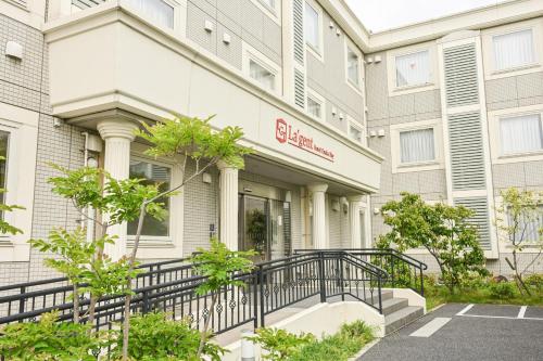 a building with a staircase in front of it at La'gent Hotel Osaka Bay in Osaka