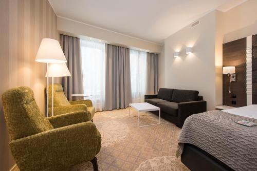 Postel nebo postele na pokoji v ubytování Lydia Hotel