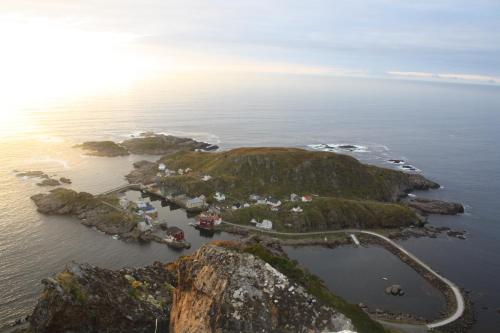 an aerial view of a small island in the ocean at Holmvik Brygge Nyksund in Nyksund
