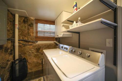 a small kitchen with a stove and a sink at Gatekeeper Cottage Views, Fireplace, EV in Afton