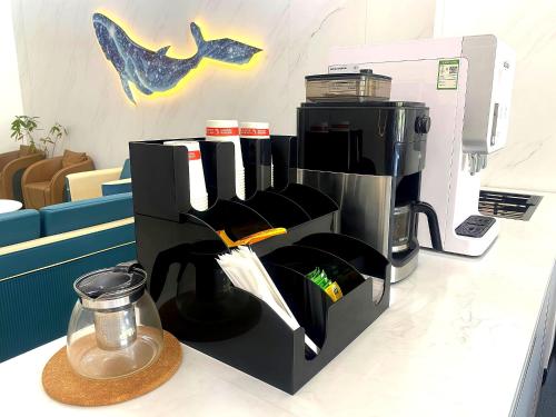 a coffee maker sitting on top of a counter at City Center Hotel Manila Near Airport and PITX Casinos Exhibition Center in Manila