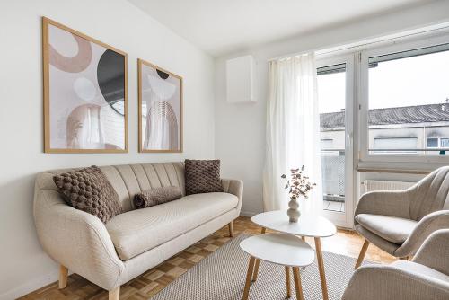 a living room with a couch and two chairs at COZY 1 !Gratis Parken, Free Parking! in Weinfelden