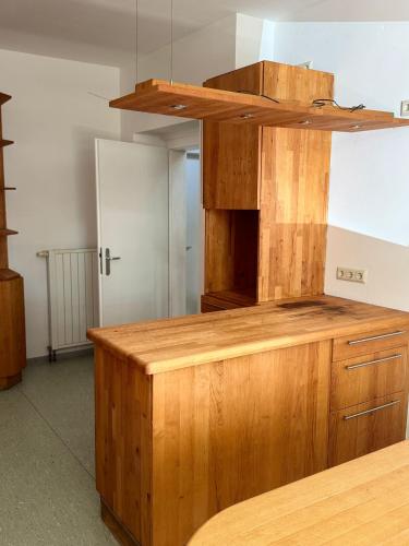 a kitchen with a wooden counter top in a room at monteur-zimmer in Dillingen an der Saar