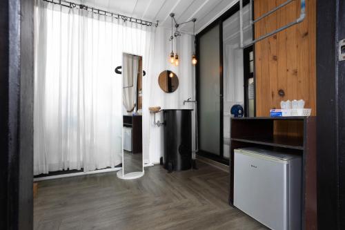 a bathroom with a shower in the corner of a room at serene hotel in Chiang Mai