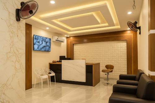 a lobby with a waiting room with a large door at Sg Happy Stay in Machilīpatnam