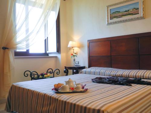 Katil atau katil-katil dalam bilik di Relais Sant'Eligio