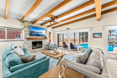 a living room with couches and a fireplace at 464 Indian Creek Dr in Cocoa Beach