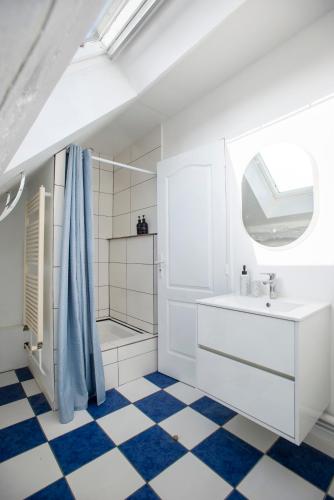 a white bathroom with a sink and a shower at Casa Dina - in Chalon-sur-Saône