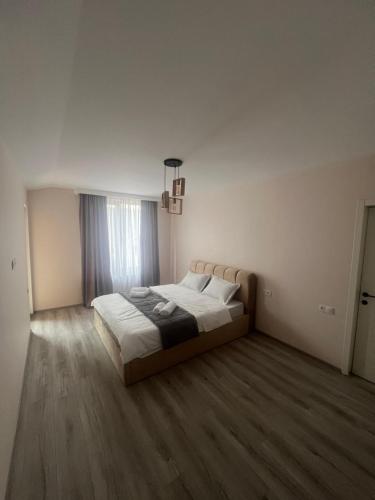 a bedroom with a large bed in a room at Mtskheta View Hotel in Mtskheta