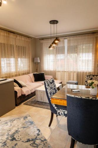 a living room with a couch and a table at Dimitris Apartment in Karditsa