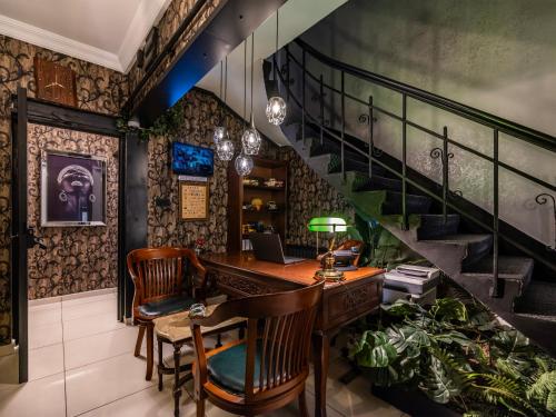 an office with a desk and a staircase at Perazre Hotel in Istanbul