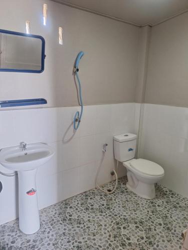 a bathroom with a toilet and a sink at Champa resort in Don Det