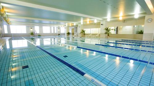 a large swimming pool in a large building at Chill Place 120 Ayase in Tokyo
