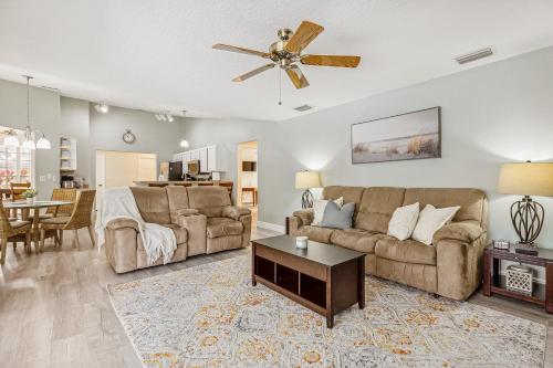a living room with a couch and a table at 601 Benedictine Ter in Sebastian