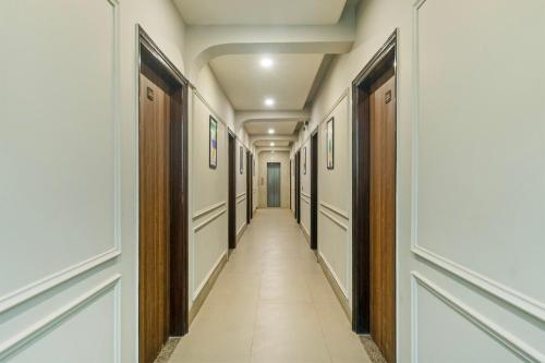 a corridor in a building with a long hallway at Treebo Aashirwad Bliss Inn With Swimming Pool in Jaipur