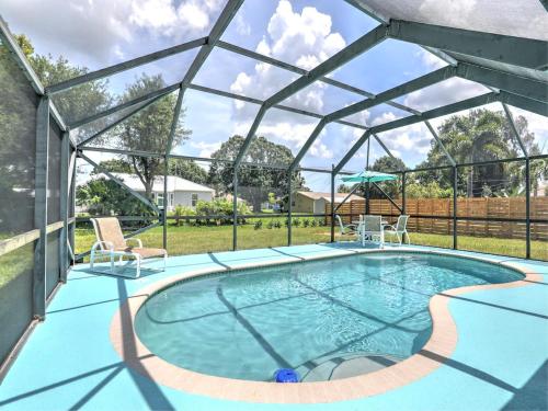 a swimming pool with a glassconservatory with at 882 Cody Avenue in Sebastian