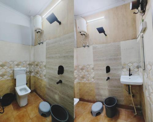 a bathroom with a toilet and a sink at HoTEL METRoVIEW in Bahādurgarh