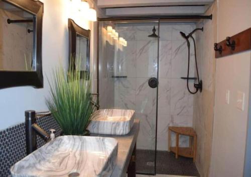 a bathroom with two sinks and a shower at Rivers Edge Lofts - Unit 9 in Niles