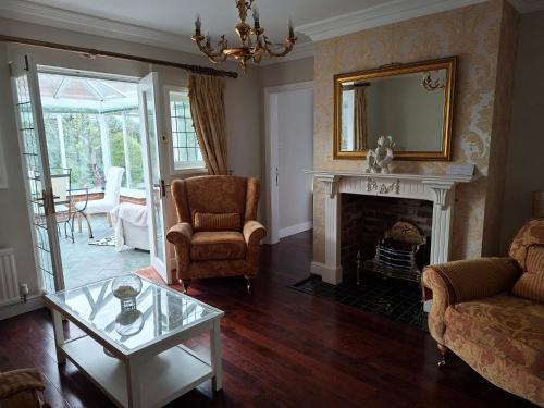a living room with a fireplace and a mirror at Annasrose cottage in Middlesbrough