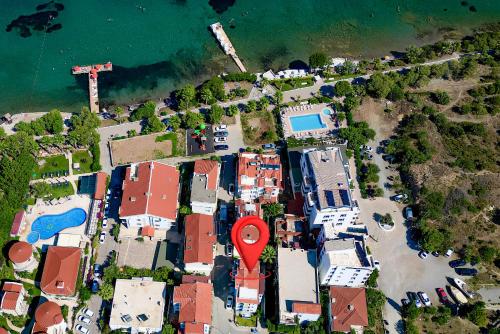 an aerial view of a city with a red marker at Sahil Apart in Datca