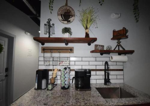 a kitchen with a sink and a counter top at Rivers Edge Lofts - Unit 7 in Niles