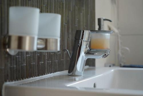 a faucet on a sink in a bathroom at Weingut Martin Blaß in Erlabrunn