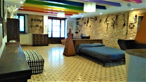 a living room with a rainbow painted wall at Casale Civetta in Senigallia