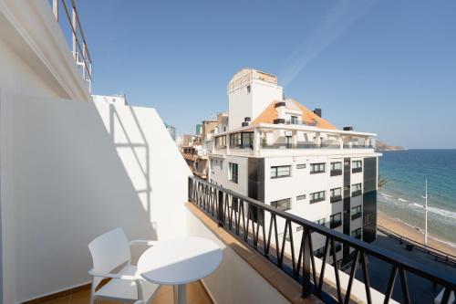 a balcony with a view of the ocean at Estudios RH Sol in Benidorm