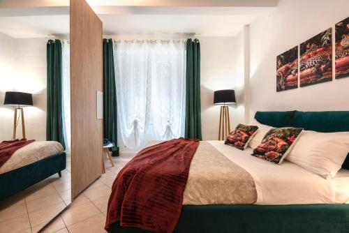 a bedroom with a bed and a large window at T'amo House in Macerata