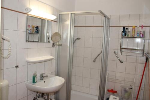 a bathroom with a sink and a shower at Fereinwohnung an der Ostsee E310 in Brasilien