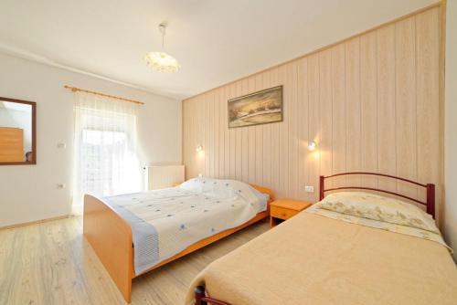 En eller flere senge i et værelse på Apartment Pula, Istria 3