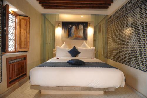 Ein Bett oder Betten in einem Zimmer der Unterkunft Riad Kalaa 2