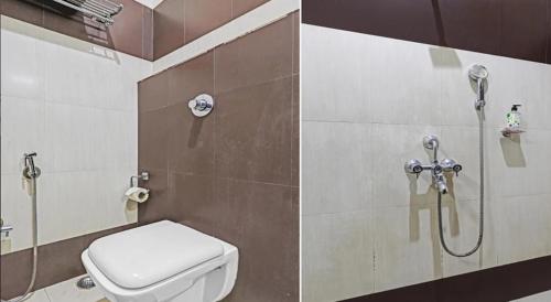 a bathroom with a shower and a toilet in it at Hotel Apollo in Guwahati